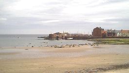 View to West Bay beach at North Berwick, with the harbour entrance in the distance
