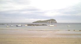 West Bay with the Craig island visible plus small sailing craft at anchor